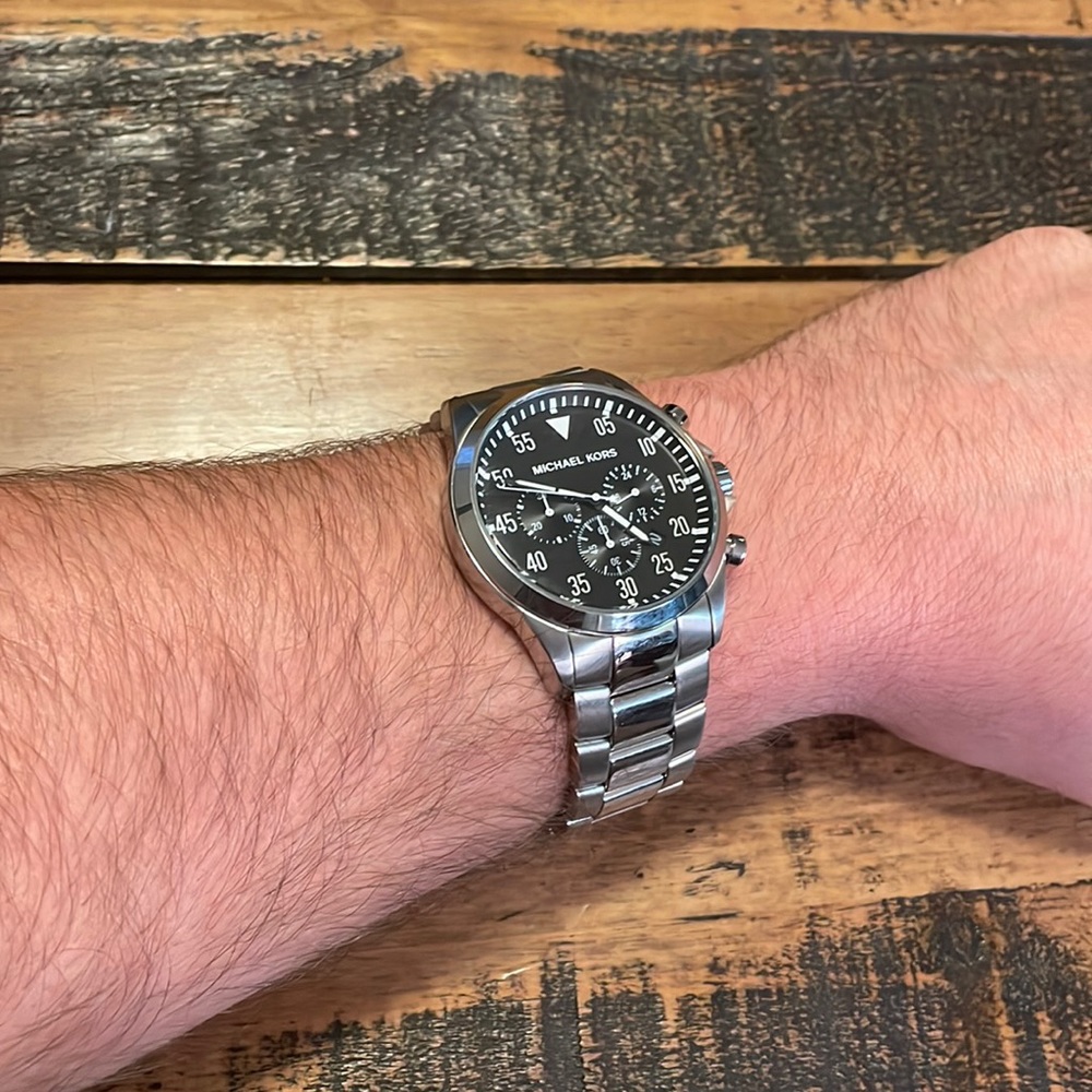 MICHAEL KORS Stainless Steele Men’s Watch with Black face and subdials.